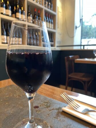 a glass of red wine at Le Siffleur de Ballons, the wine bar in Paris, France