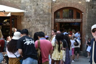 the queue in front of a gelato shop in San Gimignano in Tuscany, Italy