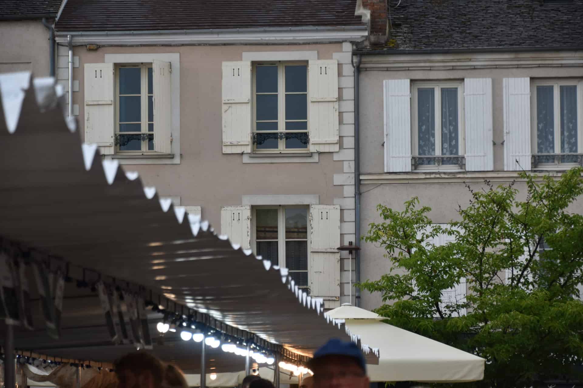 the outdoor market and the houses around there in Fontainebleau in France