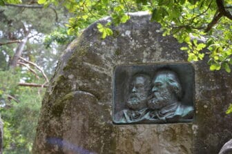 the faces of Millet and Rousseau carved on the rock in Fontainebleau Forest, France
