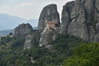 a monastery perched on the rock in Meteora in Greece
