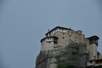 a monastery on top of the rock in Meteora, Greece