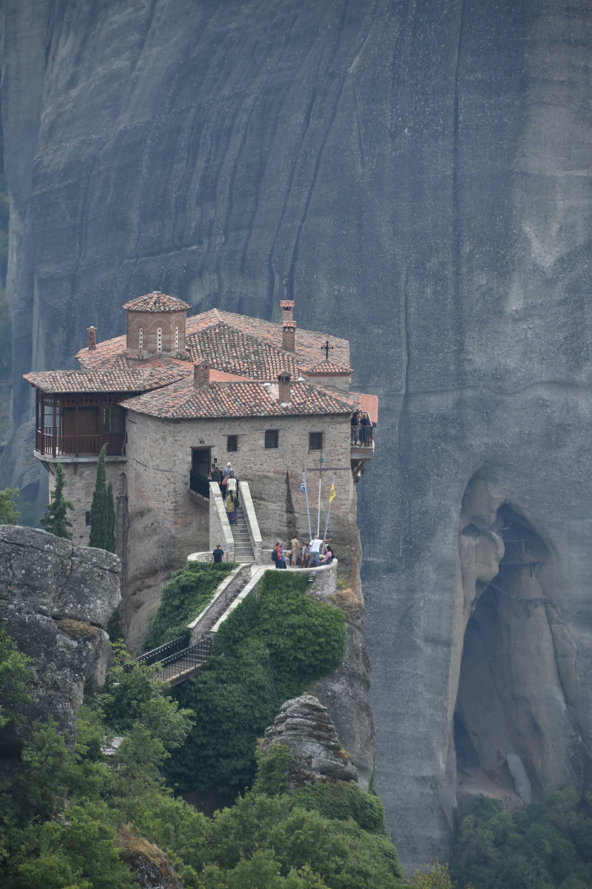a monastery perched on the rock in Meteora in Greece