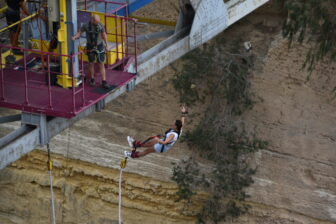 a person bungee jumping at Corinth Canal, Greece