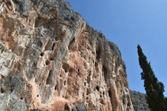 the rock cliff along the path to Karathona Beach rom Nafplio town in Greece 