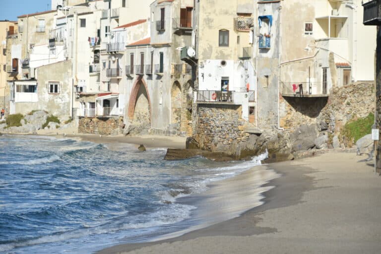 the houses by the beach in Cefalu, Sicily in Italy