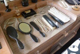 a woman's things lined up in Coleton Fishacre, a historic house near Dartmouth in England