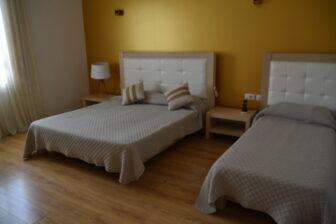 a bedroom of Grand White City Hotel , a hotel in Berat in Albania