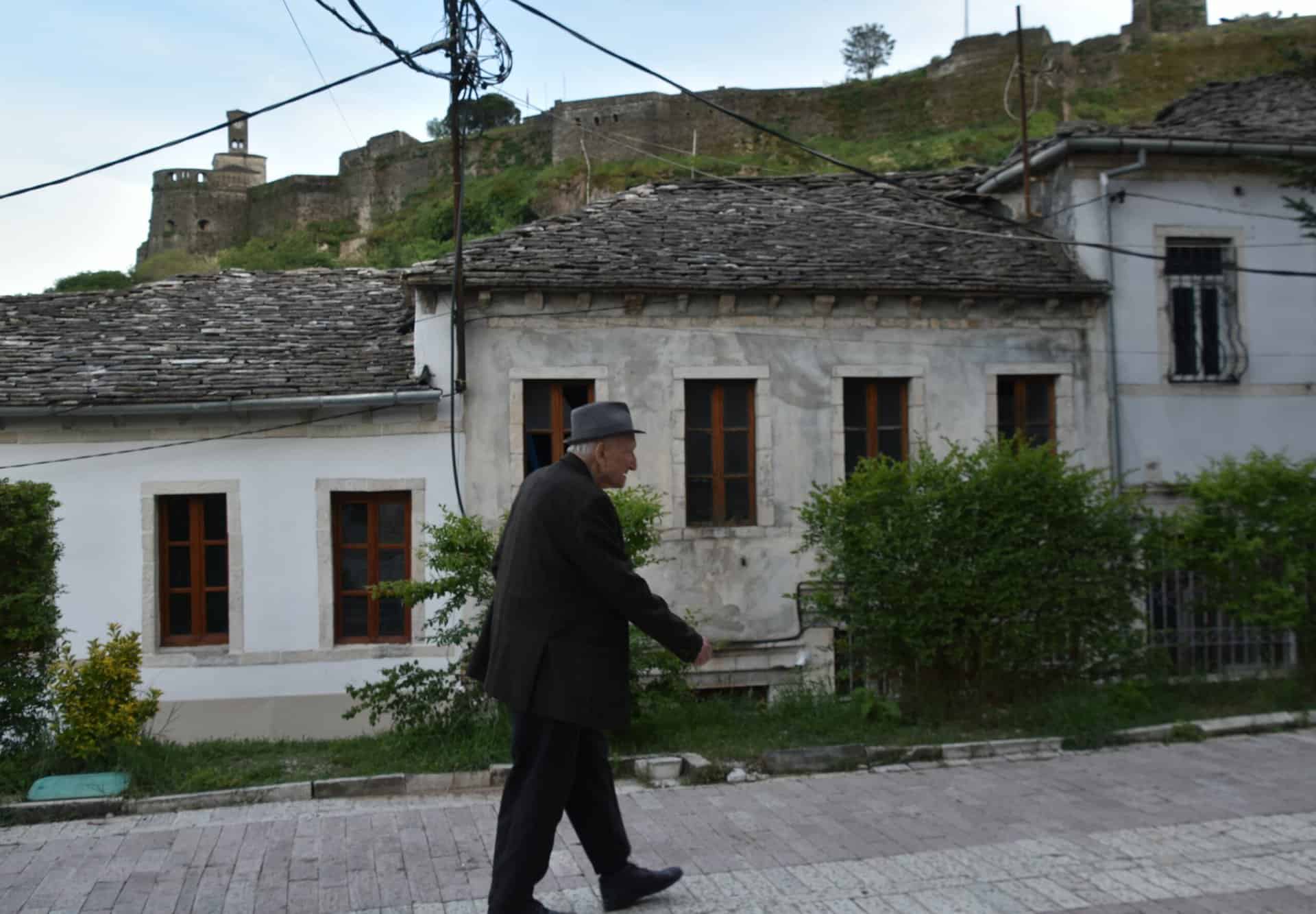 a local person walking in Gjirokaster, Albania