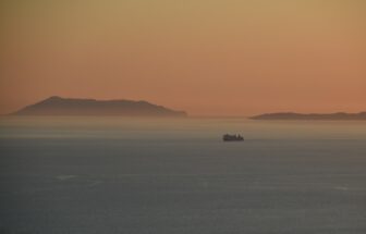 Greek islands and a boat seen from the hill of Lekursi in Saranda, Albania