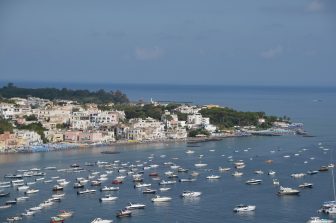 many boats moored on the sea seen from the Castello Aragonese d'Ischia on Ischia island in Italy