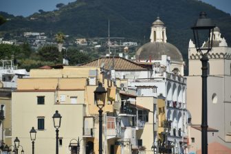 the town of Ischia Ponte which is connected to Castello Aragonese d'Ischia on Ischia island in Italy