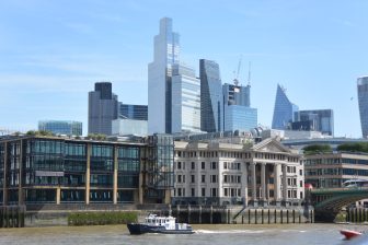 buildings along the river seen from the sightseeing boat on Thames in London