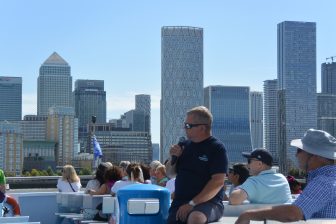 the tour guide of the sight seeing boat trip on Thames River in London