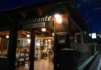 the entrance of the rabbit dish specialised restaurant called Taverna Verde at night on Ischia island in Italy