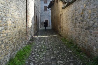 a street in the historic stone town of Castell'Arquato in Italy