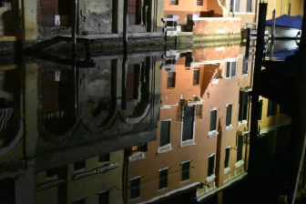 the reflections on the canal at night in Chioggia in Veneto, Italy