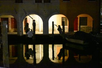 the reflections on the canal at night in Chioggia in Veneto, Italy