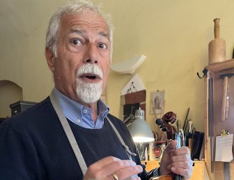 Mr. Robert Gasser, the violin maker in his violin workshop in Cremona, Italy