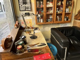 a violin maker's workshop in Cremona, Italy