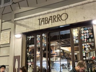 the entrance of Enoteca Tabarro in Parma, Italy