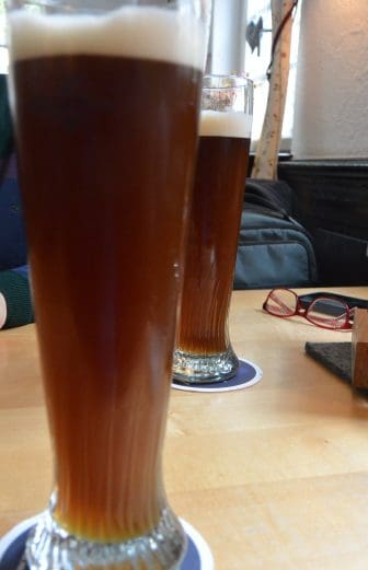 two glasses of dark beer at Paulaner am alten Postplatz, a restaurant in Stuttgart, Germany
