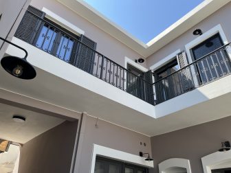 looking up at the terrace of our Airbnb in Agios Nikolaos on Crete, Greece