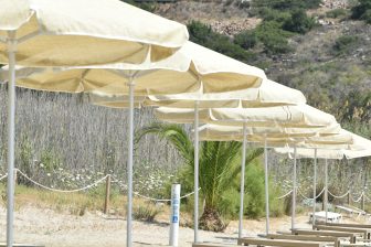 parasols at Almyros Beach near Agios Nikolaos on Crete, Greece