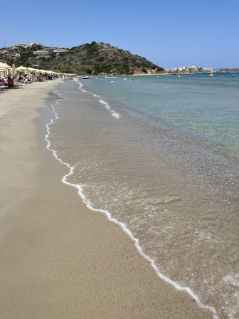water's edge at Almyros Beach near Agios Nikolaos on Crete, Greece