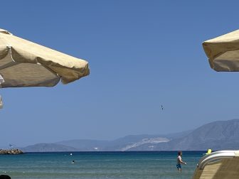 the sea seen from the deckchair at Almyros Beach near Agios Nikolaos on Crete, Greece
