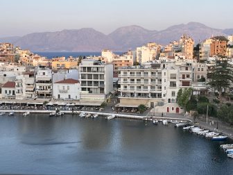 the view of the lake soon after the sunset seen from the café in Agios Nikolaos on Crete, Greece