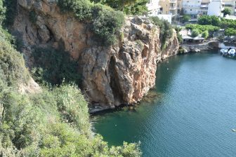  the café is on top of this cliff in Agios Nikolaos on Crete, Greece