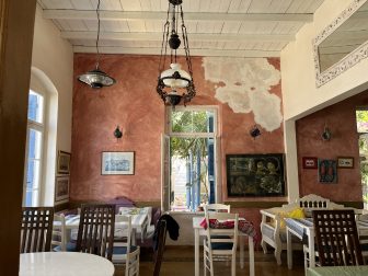 indoor tables at Pelagos, a seafood restaurant in Agios Nikolaos on Crete, Greece