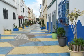 the colourful street where the restaurant located in Assilah, Morocco