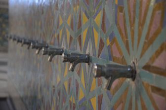 faucets along the wall of the washing area of the Hassan II Mosque in Casablanca, Morocco