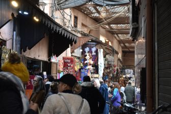 many people walking in the souk in Marrakesh, Morocco