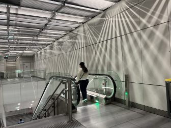 the escalator going down to the platform of Orly Airport metro station in Paris, France