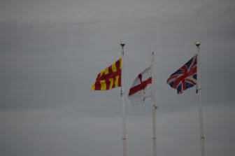 three flags on the England side at the border between Scotland and England