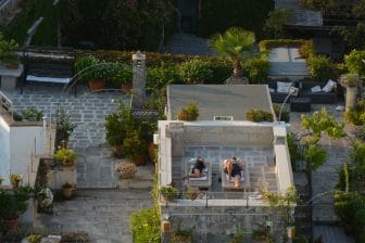 people on the rooftop just below the bell tower of Duomo di Lecce in Apilia, southern Italy